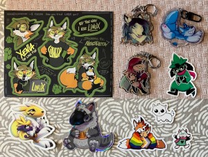 stickers: Xenia by Neotheta, Renamon, a grey protogen, two foxes in a rainbow flag, autism creature, Undertale/Deltarune; charms: something by Neotheta, a pooltoy, something
