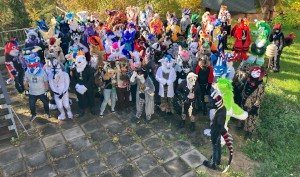 fursuiters standing in a tight group outside