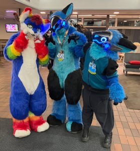 a blue/white/rainbow canine, two blue/black protogens